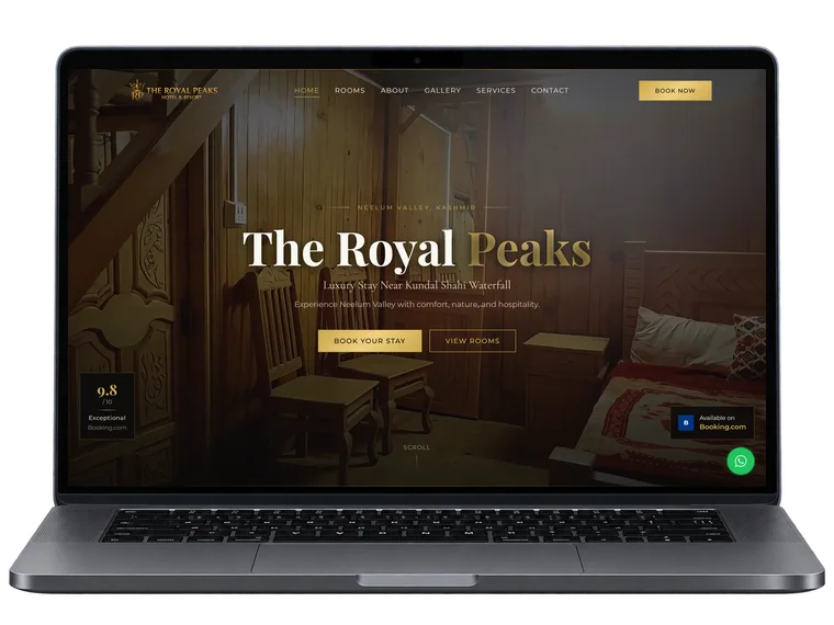 The Royal Peaks hotel website homepage shown on a laptop, reading 'Luxury Stay Near Kundal Shahi Waterfall' over a wood-panelled guest room
